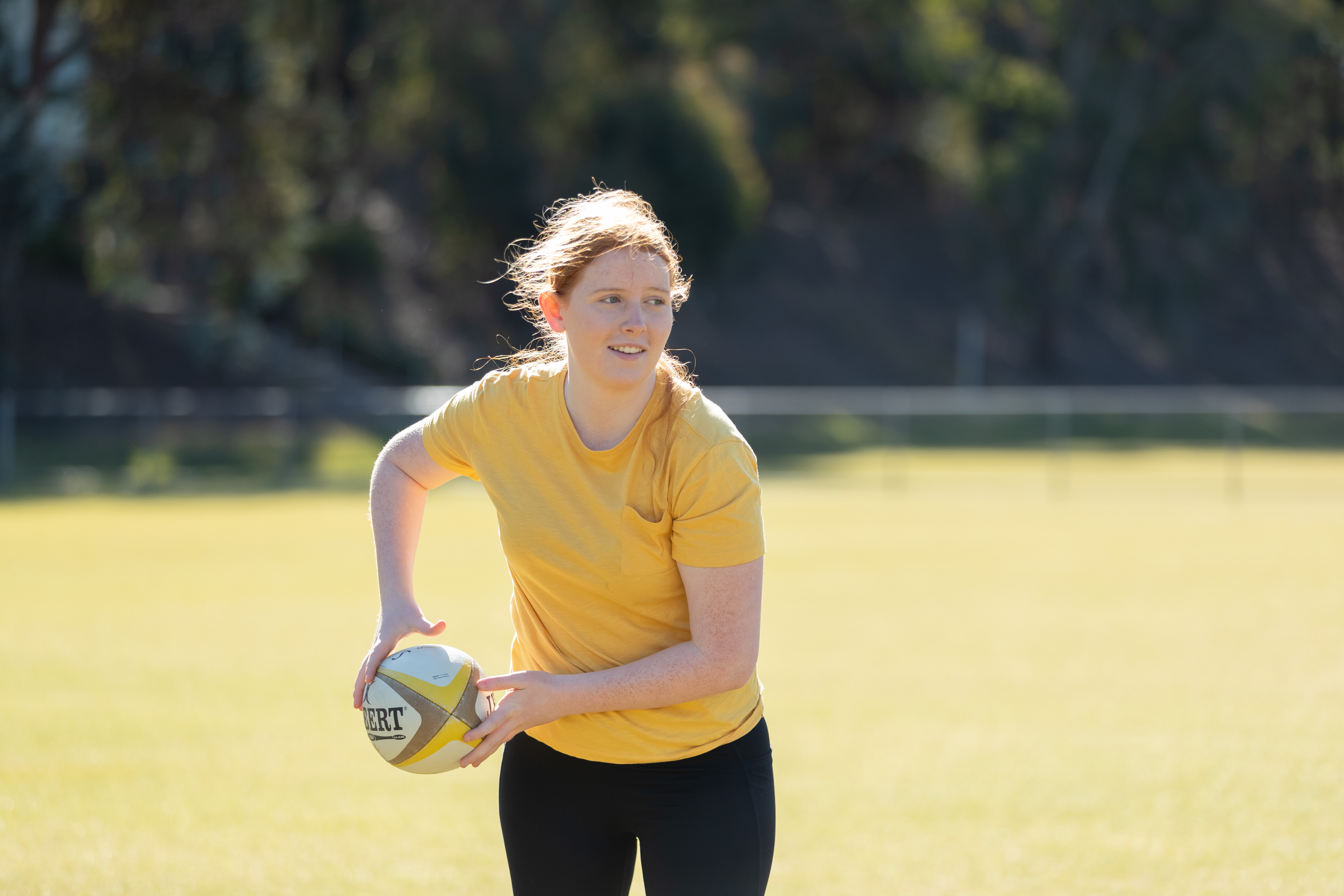 Image of girl playing touch football