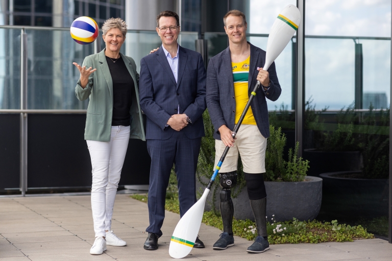 Deloitte Australia team members Natalie Cook OAM and Curtis McGrath OAM standing alongside ASC CEO Kieren Perkins OAM. 