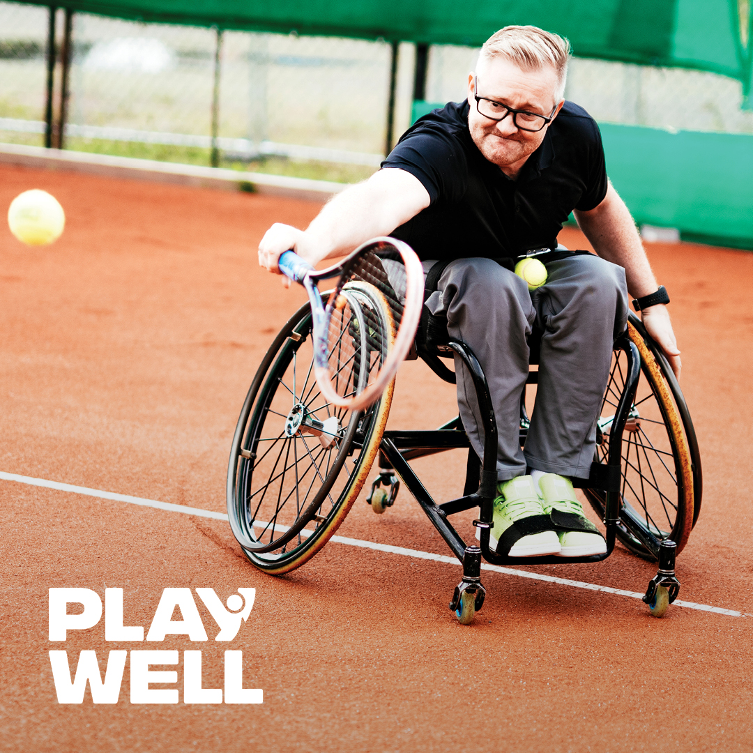 Man playing wheelchair tennis